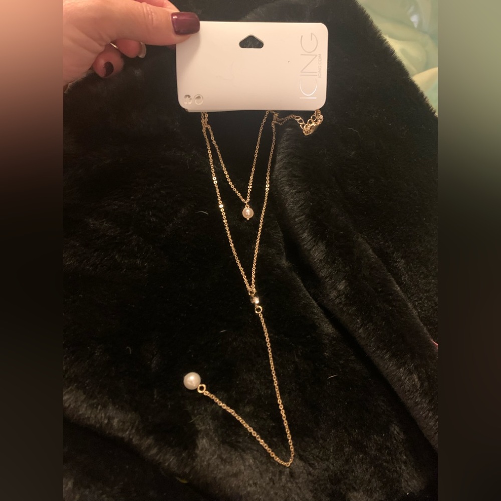 ICING gold tone two strand necklace with pearl and rhinestone accents.